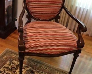 For a pop of color we are offering this pair of wooden open armchairs with curved arms; striped upholstery on seat back and back of chair. Measures: 40”h x 28”w x 21 1/2”d
Asking: $400 pr
