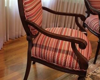 For a pop of color we are offering this pair of wooden open armchairs with curved arms; striped upholstery on seat back and back of chair. Measures: 40”h x 28”w x 21 1/2”d
Asking: $400 pr
