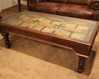 Decorative coffee table possible made from Bali door, set under glass, 19”h x 53 1/2” x 27”
Asking: $400
