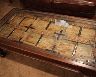 Decorative coffee table possible made from Bali door, set under glass, 19”h x 53 1/2” x 27”
Asking: $400
