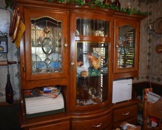 Beautiful Breakfront Dining Room Cabinet featuring lighted display cabinet and storage for silver, linens, etc. plus matching round oak table and chairs still to be pictured