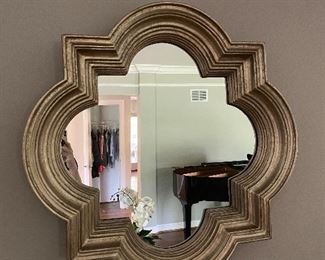 ornate mirror over sofa