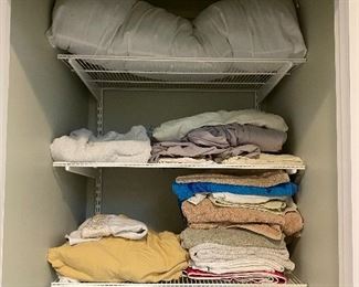 Closet lot of linens and towels including sink items and towels $15