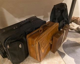 Lot of luggage and badmitton game $20