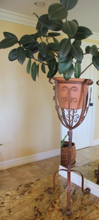 #7.  $75.00.  Iron plant stand with plant 40” tall X 15” diameter 