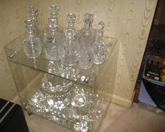 Ralph Lauren crystal decanters and other unmarked decanters, signed crystal chocolate drops, Fostoria American pedestal cake stand with well and more Oleg Cassini crystals