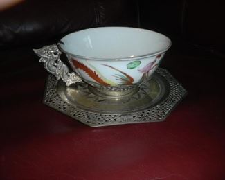 antique china tea cups with silver saucers