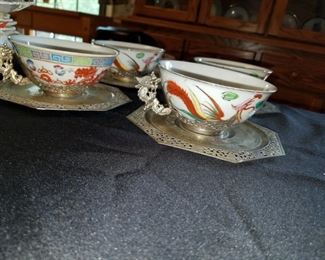 set of 4 antique tea cups on silver saucers