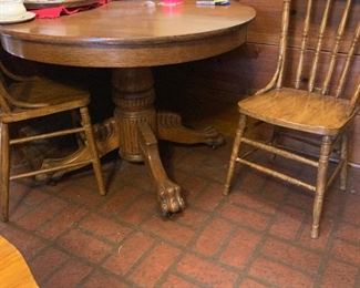Antique Oak table with claw feet & 4 press back chairs