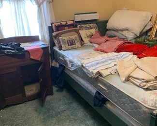 Full size bed , newer mattress & lots of linen