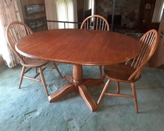 $50, oak table and three chairs 55 by 43 with leaf can be smaller
