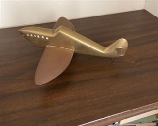 Owner's collection of memorabilia from his RAF days - and the Dam Busters raid in which he participated.  Original newspaper article, historical book, poster, hand constructed bronze Lancaster airplane, etc