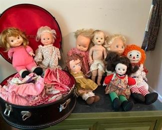 Assorted dolls and clothes 