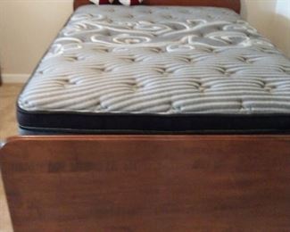 Vintage handcrafted full size wooden bed. Headboard, foot board and frame in great shape.  Brand New Kingsdown pillow top mattress and box springs.