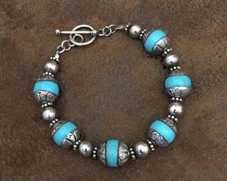 7 3/8" sterling silver and Tibetan turquoise beads with toggle clasp.   $90
