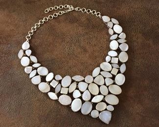 Drop-dead gorgeous druzy bib necklace in shades of champagne, cream, pastel gray! Featuring 59 druzy stones set in sterling silver, finished with thick sterling silver chain and clasp.  Adjustable from 16"-22" Long.   Definite statement piece.  $268
