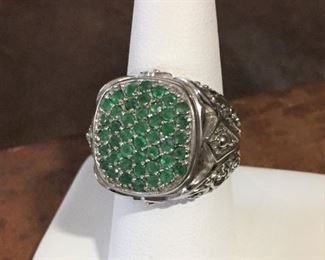 Size 8 ornate Thai sterling silver ring topped with a bed of tiny emerald green gemstones.  Stamped THAILAND SX 925 inside the band. $128
