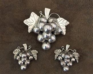 Large Taxco sterling grape cluster brooch/pendant and earrings.  Brooch/pendant is 2 5/8" x 2 1/2", and signed MEXICO 925 and JG-106, price is $122.        
Clip earrings are 1 3/8" x 1 5/8", stamped MEXICO TC-134 and 925, price is $78 or ($170 for the set).
