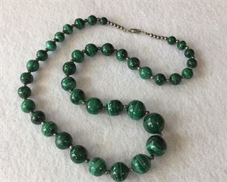 Vintage 22"  sterling silver and malachite beaded necklace. Malachite beads are graduated from 15mm (largest) to 7mm (smallest). $94
