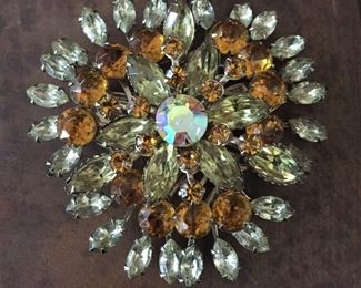 Gorgeous retro glam brooch with round and marquise-shaped clear and gold-colored prong-set rhinestones.  Size 2 3/4" x 2 3/4".  Rolling c-clasp. $50
