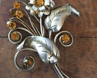 LARGE Sterling silver Art Nouveau floral brooch with beautifully detailed flower, leaves and tendrils that feature sparkly gold rhinestones. 2 3/8" x 3 1/8". Marked STERLING on back. $120

