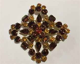 Huge Sparkly large vintage brooch with beautiful  prong-set gold, amber, and cognac rhinestones.   Size 3 3/8" x 3 3/8" with rolling C-clasp.  $70
