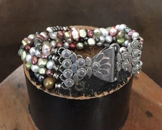 Multi-strand freshwater pearl bracelet with beautiful sterling silver clasp. 7 1/4", stamped 925 on clasp.   Much prettier in person.  $130 
