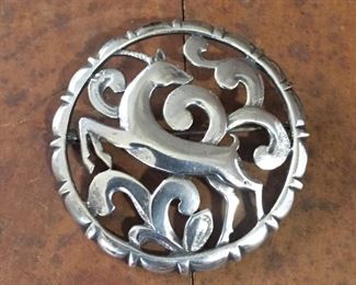 Stunning sterling circular brooch.  2" diameter, stamped STERLING on back side. $120
