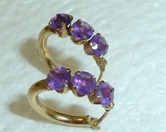 Small 14k yellow gold and amethyst earrings.  They measure 5/8" across.  They are marked 14k and initials JCM.  $120
