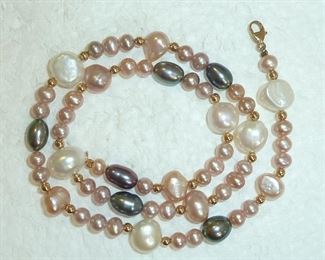14k yellow gold clasp and accent beads adorn this 16" genuine pearl necklace in blush, lavender and peacock colors.   $130
