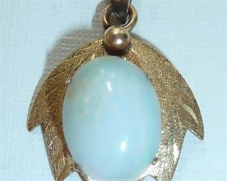 Fiery genuine opal set in 14k yellow gold.  From bale to tip, it is one inch long.  Stamped 14k and BB.  Really beautiful.  $130