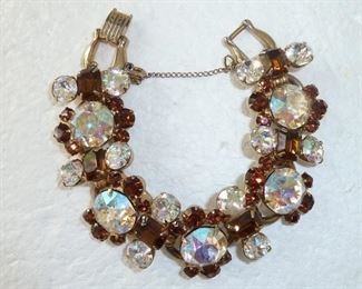 Stunning vintage Juliana link bracelet featuring round clear Aurora Borealis rhinestones surrounded by round and rectangular cognac-colored rhinestones.  7 1/4"  x 1"  with clasp and safety clasp.  $160