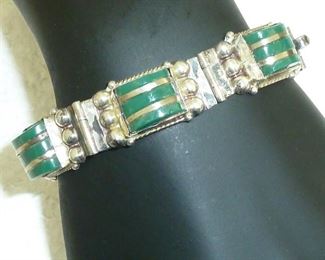 Sterling silver and green onyx Mexico bracelet.  Signed ANR, 925, IGUALA, and Mexico.  1/2" wide, 7" long.  Has patina that could be polished.  $110