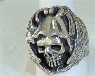 Huge chunky heavy sterling silver skull ring.  Size 11.   Weighs 28.8 grams, marked 925.  Ring is one inch tall.  $280