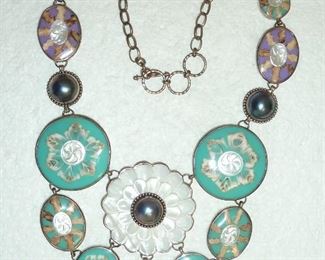 Awesome statement necklace, measuring 3.5" from the top of the center flower to the bottom of the drop below.  Genuine huge pearls, carved mother-of-pearl, and shell.  $380
