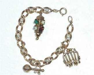 Vintage gold-filled and genuine pearl bracelet with three large charms.  Bracelet is 7.5" long, and the stoplight charm is 1 1/4".  Charming.  $150