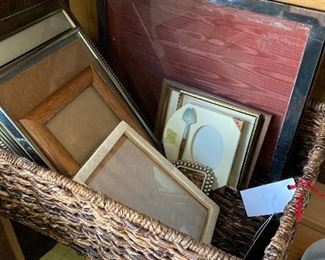 Assorted picture frames and basket
