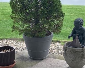 Planters & boy with sailboat Garden statue. 