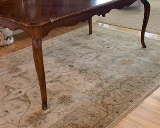 French Provincial Dinning Table. Seats 12 with leaves. Comes with pads. 1 leg has been repaired. 