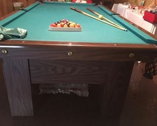 A. E. Schmidt pool table and accessories (balls, cue sticks, cover, repair kit). 56"x8'4". 