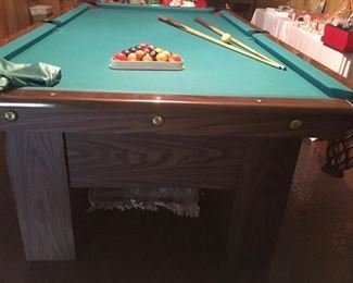 A. E. Schmidt pool table and accessories (balls, cue sticks, cover, repair kit). 56"x8'4".