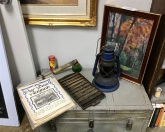 Cast iron cornbread pan, old insecticide dispenser, old DDT tin, booklets on pet care, railroad lantern, old trunk, Doris Garrington Pastel