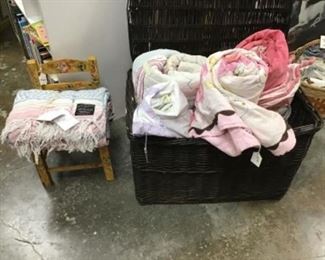Quilts, wicker chest, little painted chair