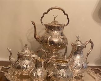 Silver plate tea service:  tray; coffee urn (with warmer); coffee pot; sugar & creamer; tea pot