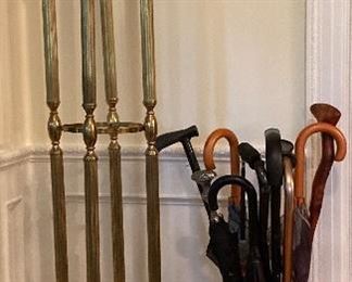 Brass coat and hat tree; brass embossed umbrella stand; various walking sticks, canes & umbrellas