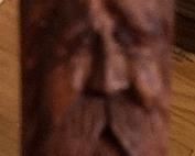 Close-up view of man's face on walking stick