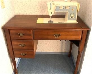 Lot 734
Singer 'Stylist' Sewing Machine and Cabinet