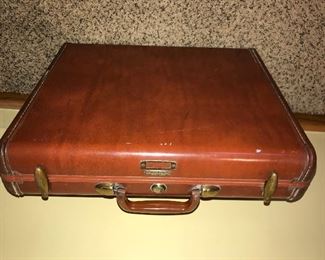 Briefcase, handle is a bit sticky $5.00 (pick up only)
