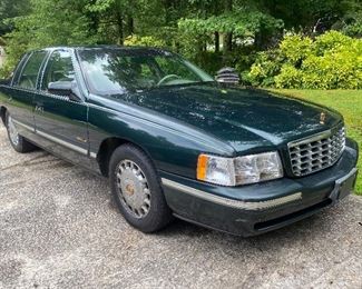 1997 Cadillac Deville
194880  miles 
Dark green with pinstripping and gold accents. 