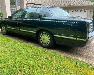 1979 Cadillac Deville
194880  miles 
Dark green with pinstripping and gold accents. 
